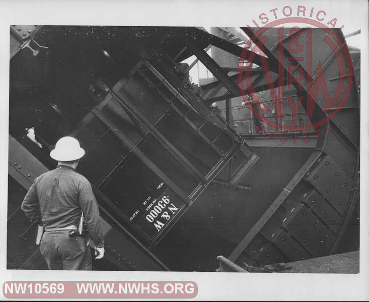 Closeup view of Class H-13 Hopper 93000 (A End visible) fully(?) rotated in car dumper on one of the Lambert's Point Coal Piers