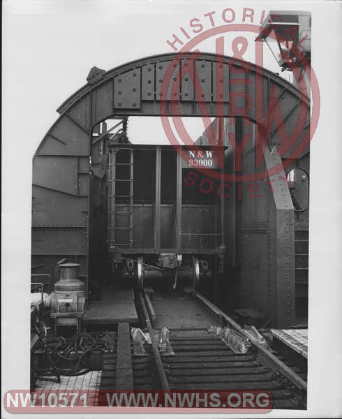 Closeup view of Class H-13 Hopper 93000 (A End visible) unrotated in car dumper on one of the Lambert's Point Coal Piers