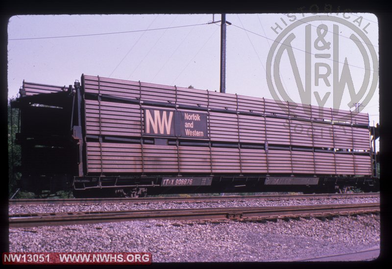 TTKX 908876 trailer train flat car with NW tri-level auto rack at unidentified location