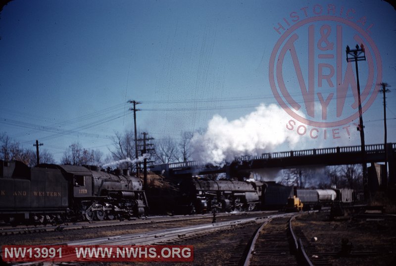 N&W A 1231 with #77 at Crewe, Va. N&W M2c 1159 on left