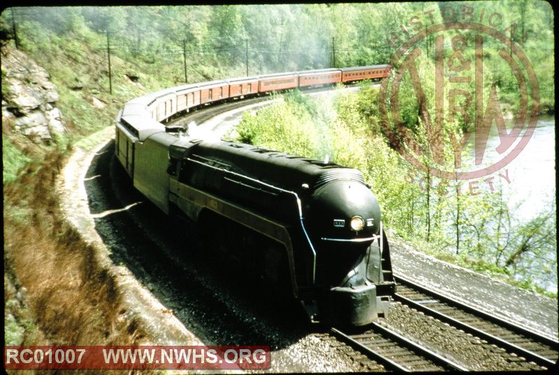 N&W Class J #613 leading a mail-heavy passeenger train