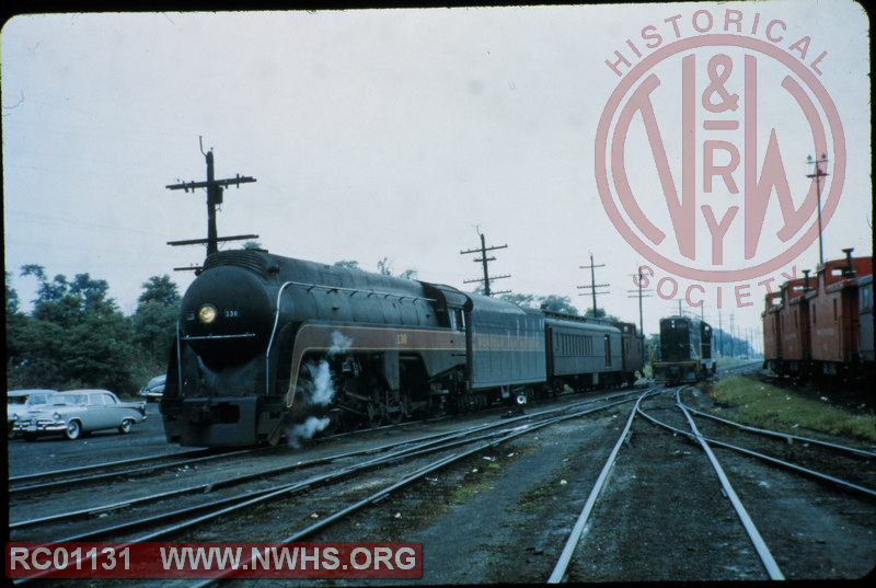 N&W Class K2a #130 with a very light load passing a diesel lurking nearby